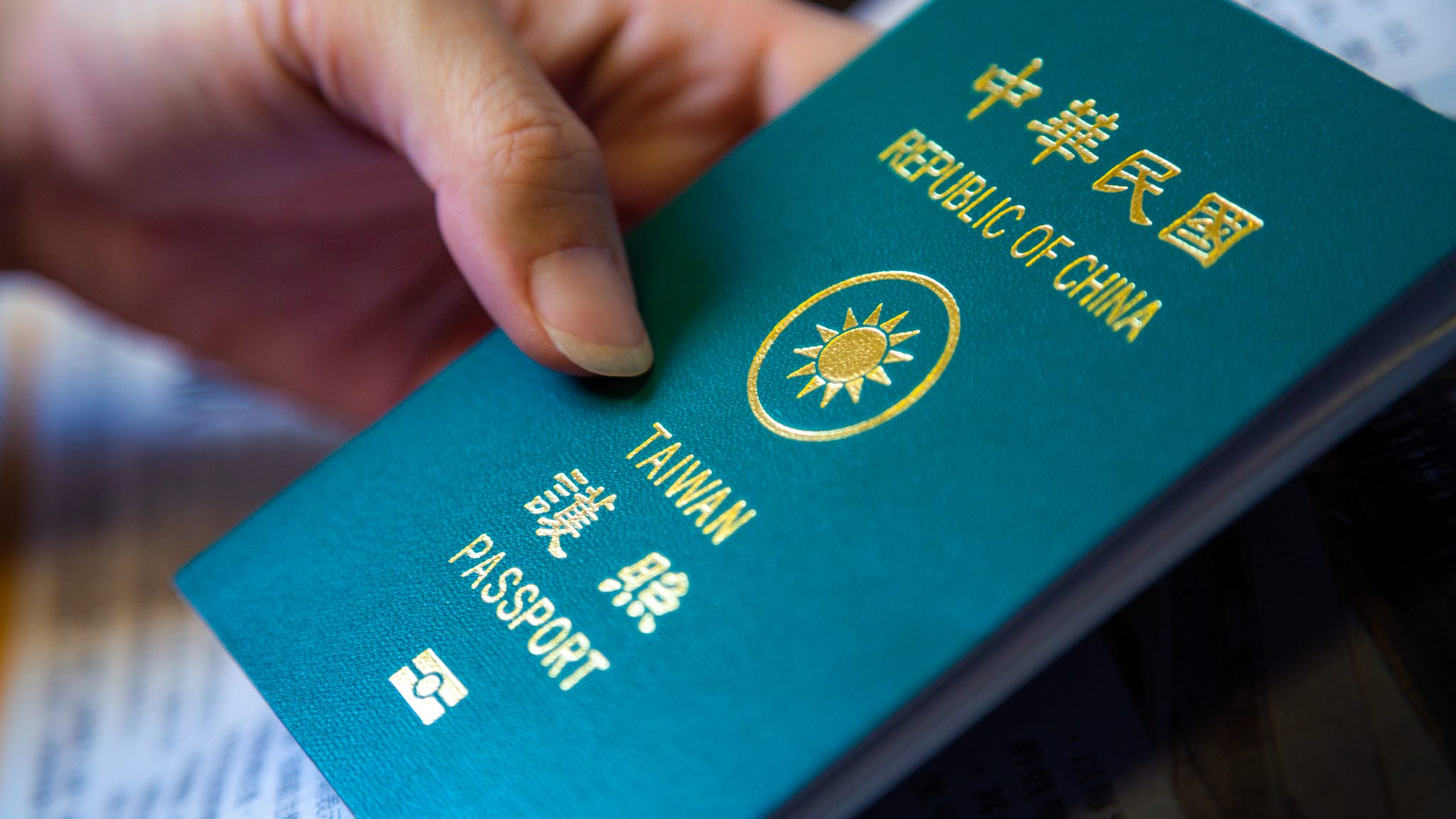 Vietnam Visa For Taiwanese Citizens Visa On Arrival Has Reopened For   Asian Woman39s Hand Hold Her Taiwan Green Passport Persons Holding Taiwanese Passport Official Document Issued By Government Travel Its Protection From Foreign Countries 2048x1152 